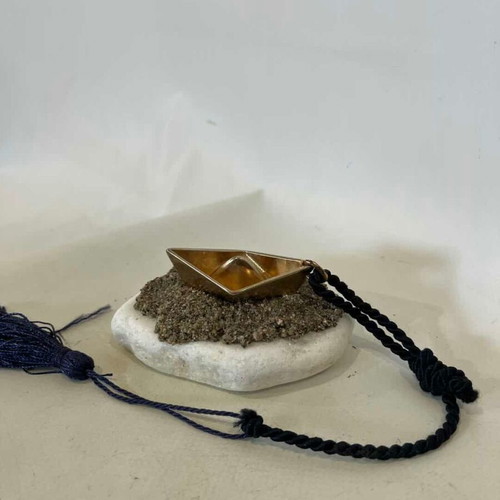Handmade table charm with bronze boat and marble stone