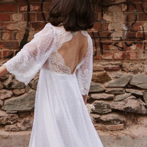 Romantic vintage-inspired wedding dress with polka dot tulle and lace