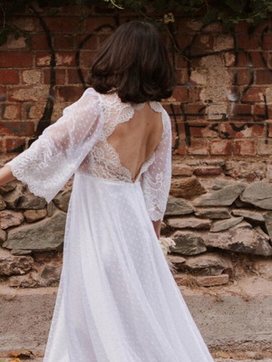Romantic vintage-inspired wedding dress with polka dot tulle and lace