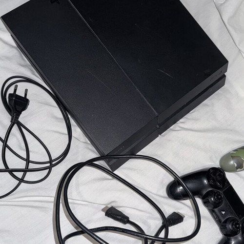 PlayStation 4 console with FIFA 19 and cables