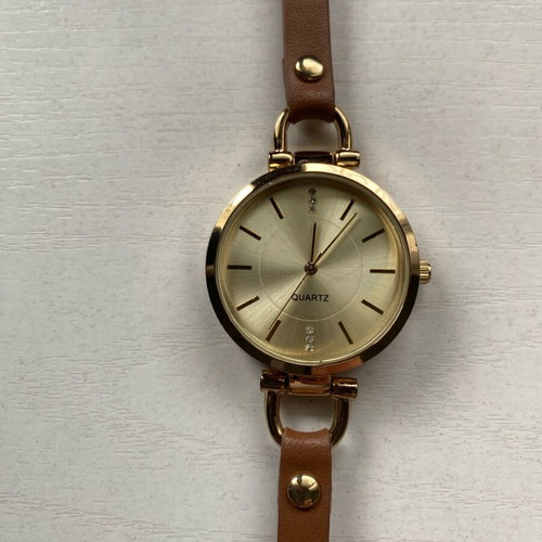 Avon women's watch like new, gold with brown strap