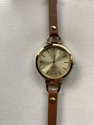 Avon women's watch like new, gold with brown strap