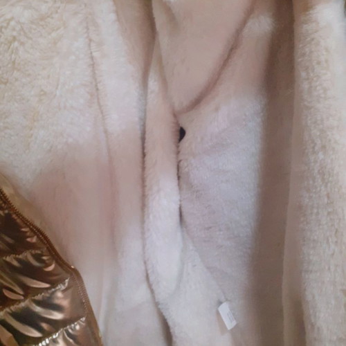 Short gold jacket with white fur and hood