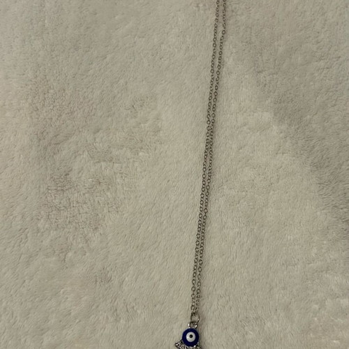 Handmade eye necklace in palm new