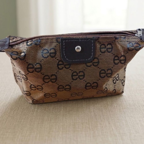 Mini toiletry set with brown-gold cosmetic bag, Apivita soap, Versace Eros Pour Femme sample