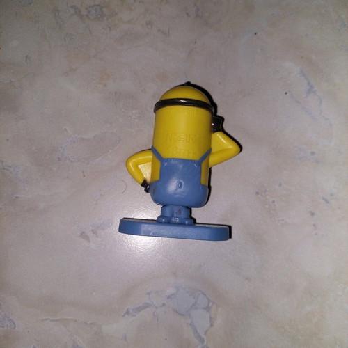 Minion figure with rotating base like new