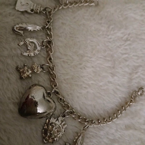 Silver bracelet with charms like new