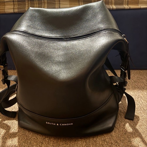 Leather backpack like new, black with orange lining