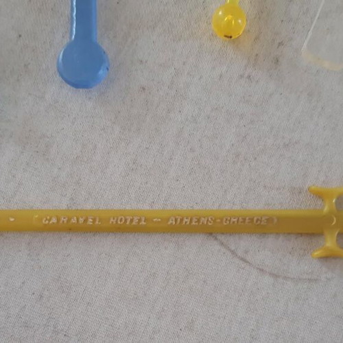 Set of 5 used plastic Caravel Hotel drink stirrers