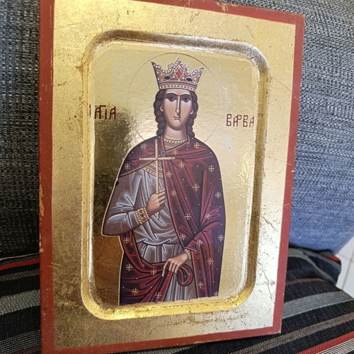 Vintage icon of Saint Barbara on carved wood, used