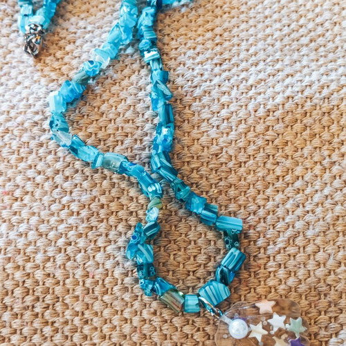 Handmade turquoise necklace with beads and transparent shell