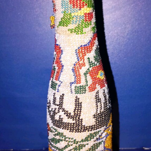 Bottle used with beads and 1924 decoration