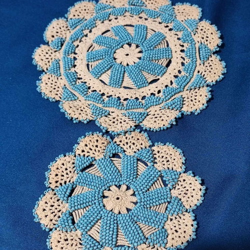 Handmade knitted doilies used with crochet and beads
