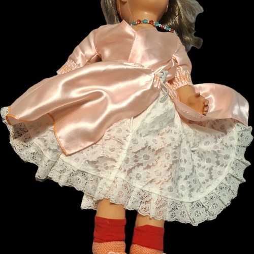 Vintage doll used with pink satin dress and knitted boots