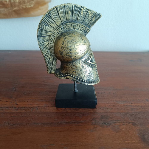 Decorative replica of ancient Greek Corinthian helmet used, bronze patina