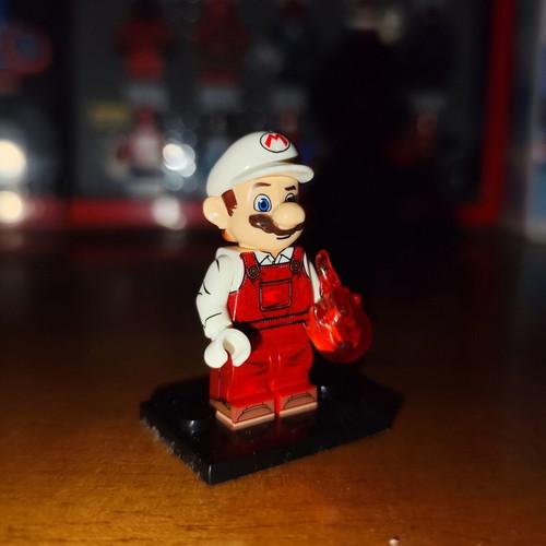 Fire Mario minifigure with orange fire and stand