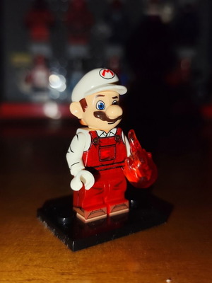 Fire Mario minifigure with orange fire and stand