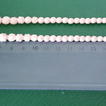 Vintage carved bone necklace with rose details