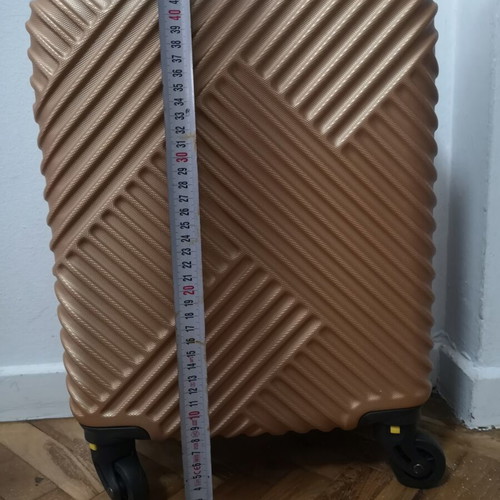 Small suitcase new, gold color