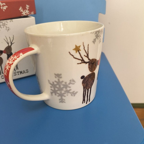 Christmas-themed mug with two reindeer