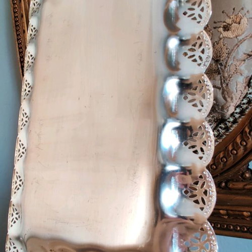 Metal serving platter used with beautiful decoration for desserts