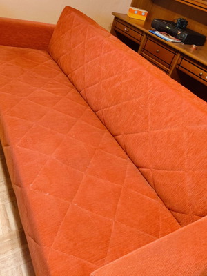 Three-seater sofa bed with storage space