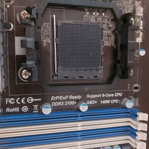 AsRock 970 Extreme4 AM3+ motherboard used, functional with updated BIOS