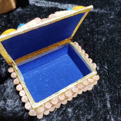 Vintage jewelry box with natural sea shells and royal velvet