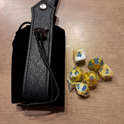 Black leather runic dice bag with yellow marbled D&D dice