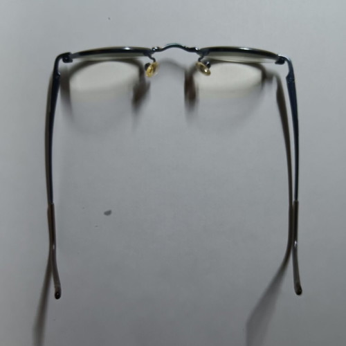 Oval children's eyeglasses used with black case