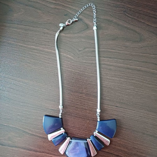 Geometric necklace used with blue and purple designs, Marks & Spencer