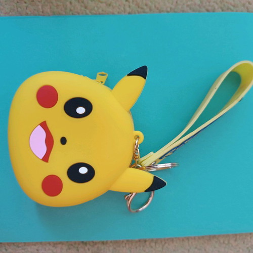 Pokémon keychain wallet used, yellow silicone