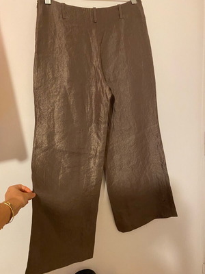 Wide pants used with silky texture and metallic shine, size 38