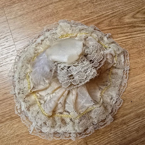 Glass bride doll like new with hat and lace