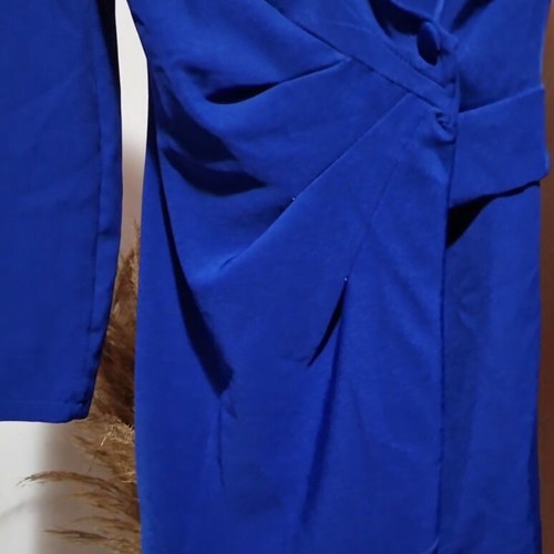 Blue dress like new with shoulder pads and decorative pocket