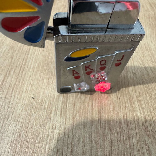 Playing card lighter used with red and yellow lights