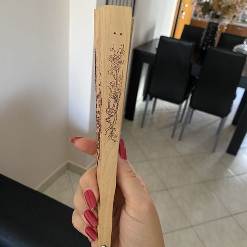 Vintage wooden hand fan used with bird designs