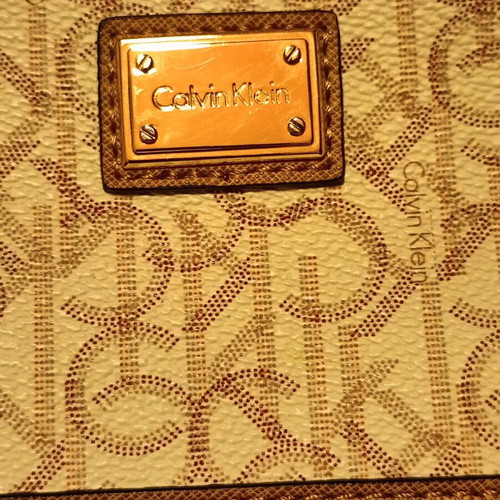Calvin Klein Monogram Wristlet pouch cream and tan, like new