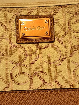 Calvin Klein Monogram Wristlet pouch cream and tan, like new