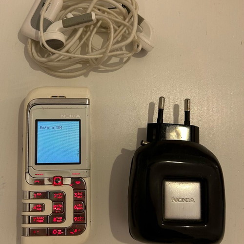 Nokia 7260 used, functional with charger and hands free