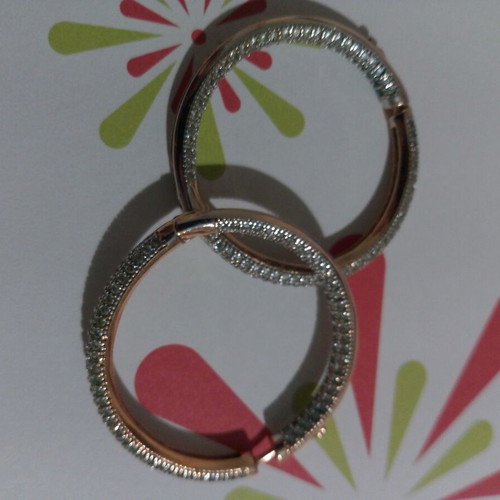 Gold hoop earrings with zircon stones