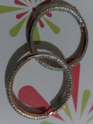 Gold hoop earrings with zircon stones