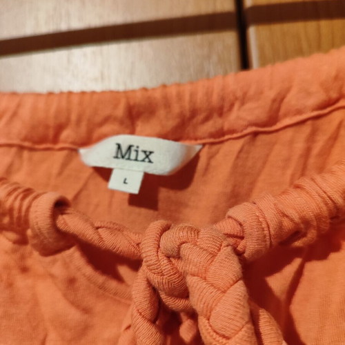Sleeveless blouse with ruching used, peach color, size L
