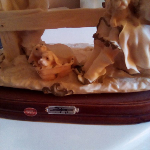 Decorative children with dogs gypsum on wood used