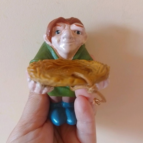 Disney figure Quasimodo holding a nest used