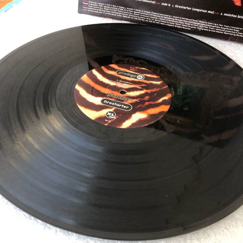 Prodigy Firestarter vinyl used, with partially worn cover