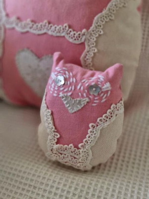 Decorative owl pillows set in soft pink cotton and lace like new