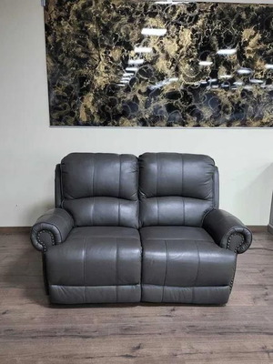 Gray leather two-seater sofa with electric footrest mechanism new