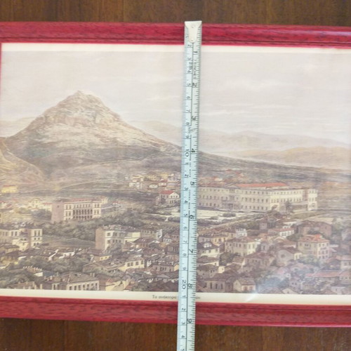 Frames with old photographic views of the Acropolis and the Palaces like new