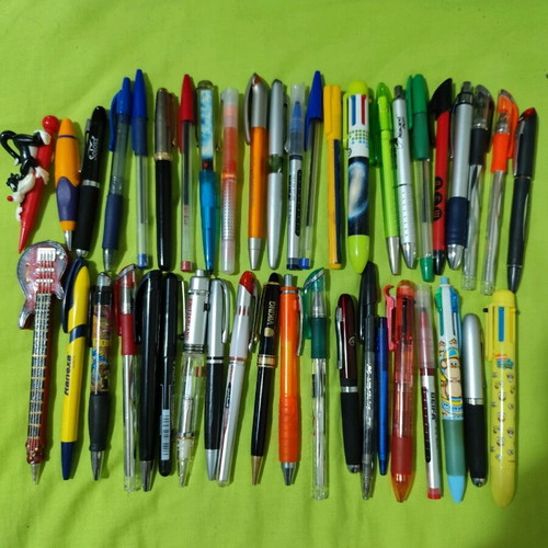 Pens and mechanical pencils used, with cases, erasers, sharpeners